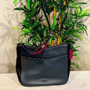 Barely used Coach Crossbody. Dark green with adjustable strap.